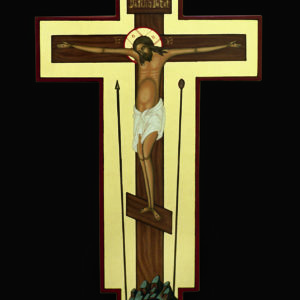 Ein stilisiertes Kreuzbild zeigt Jesus am Kreuz vor schwarzem Hintergrund mit Schädel darunter.