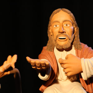 Jesus mit offen ausgestreckter Hand.